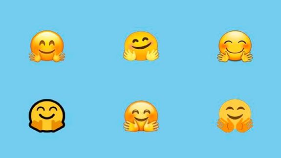 WhatsApp emoji de la carita con las manos abiertas